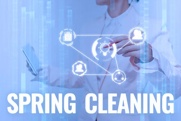 Text caption presenting Spring Cleaning. Word for practice of thoroughly cleaning house in the springtime Lady In Uniform Touching And Using Futuristic Holographic Technology. — Stock Photo, Image