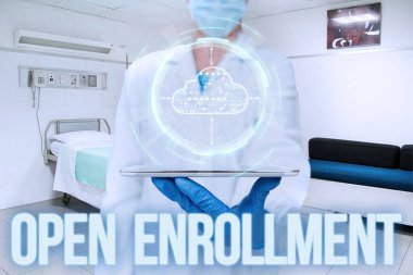 Inspiration showing sign Open Enrollment. Business idea The yearly period when showing can enroll an insurance Woman Suit Writing On Screen Holding Tablet Showing Futuristic Technology. clipart