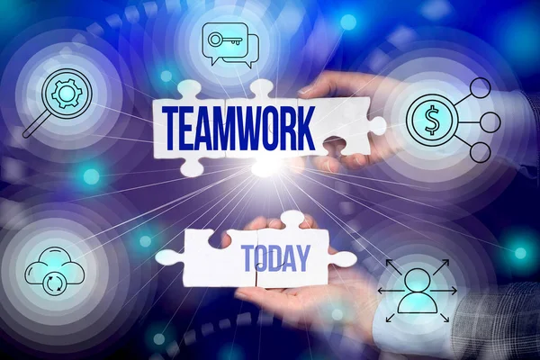 Conceptual caption Teamwork. Business overview combined action of group especially when effective and efficient Hand Holding Jigsaw Puzzle Piece Unlocking New Futuristic Technologies.