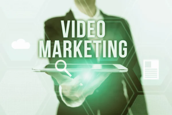 Text showing inspiration Video Marketing. Business overview integrates engaging video into the marketing campaigns Lady In Suit Presenting Mobile Device With Futuristic Interface Tech.