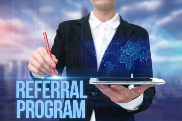 Text showing inspiration Referral Program. Internet Concept employees are rewarded for introducing suitable recruits Lady In Uniform Standing Holding Tablet Typing Futuristic Technologies. — Stock Photo, Image