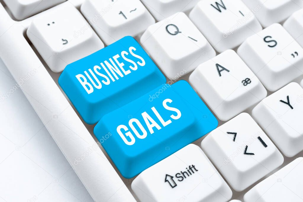 Text sign showing Business Goals. Concept meaning company expects to accomplish over a specific period of time Typing Helpful Blog Tutorial And Guides, Researching Strategies Online
