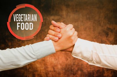 İlham veren Vejetaryen Yemekleri gösteren bir metin. Mutfak kelimesi, vejetaryen standartlarını karşılayan iki profesyonel iyi giyimli iş adamının el sıkışması anlamına gelir.