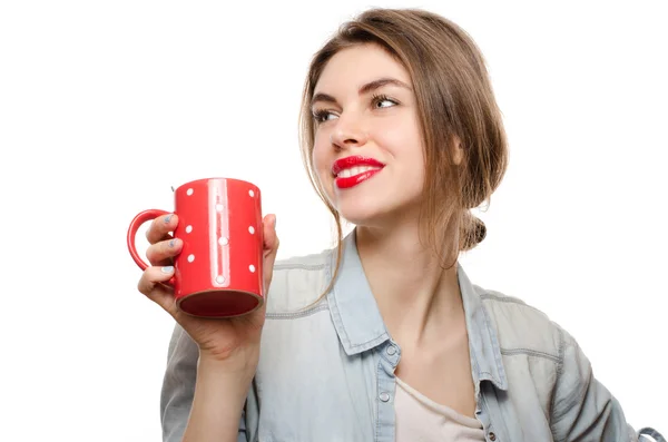 Smiling woman with red cup of tea on white background — Stock Photo, Image