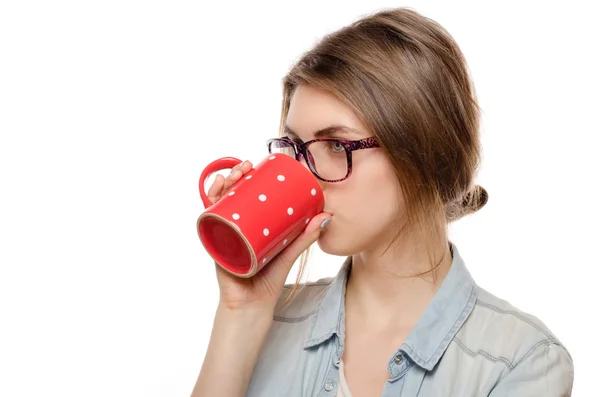 Girl enjoys her cup of tea on white background — Stock Photo, Image