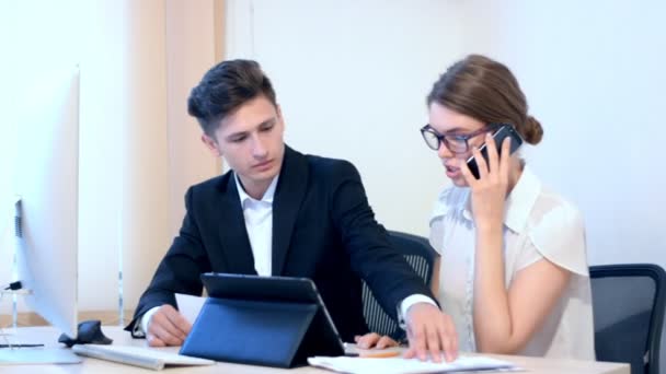 Work process at office, woman calling for information — Stock Video