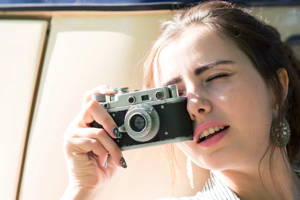 happy young tourist woman or teenage girl with film camera