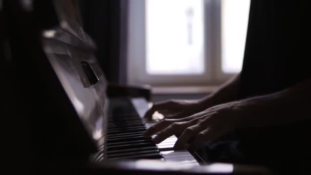 Close-up of males hands practicing to play the piano at home — Stock Video