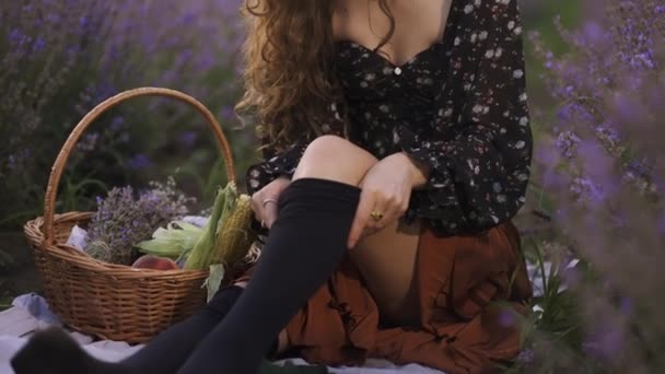 Sensual woman on lavender field, putting on black tights — Stock Video