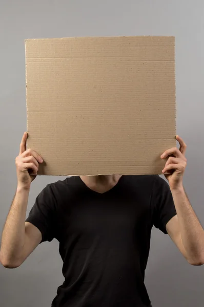 Mãos homem mostrando placa em branco — Fotografia de Stock