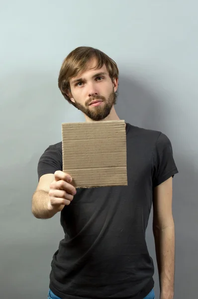 Man hands showing blank board — Stock Fotó