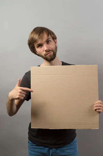 Mãos homem mostrando placa em branco — Fotografia de Stock