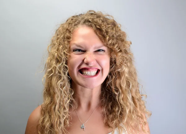 Angry curly woman — Stock Photo, Image