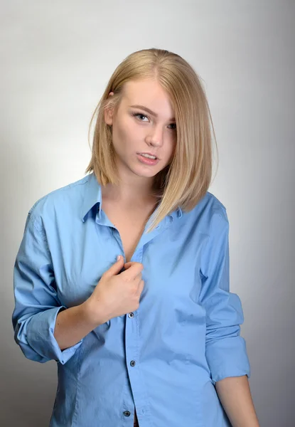 Portrait of pretty businesswoman in blue shirt Stock Image