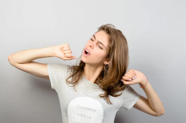 Girl yawns and stretches — Stock Photo, Image