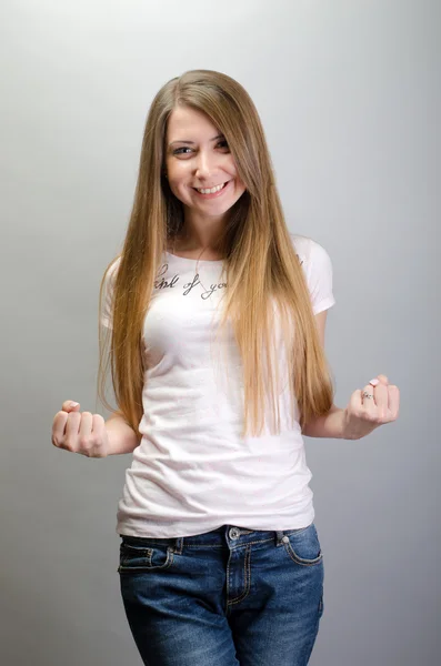 Bastante joven mujer emocionada ganar, éxito, aislado sobre fondo gris — Foto de Stock