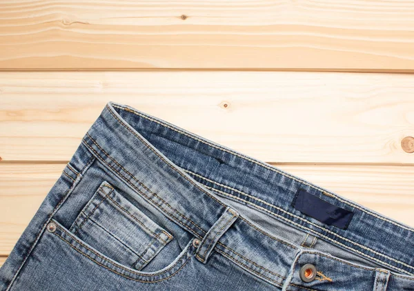 Top View Fashionable Jeans Wooden Background Copy Space — Stock Photo, Image