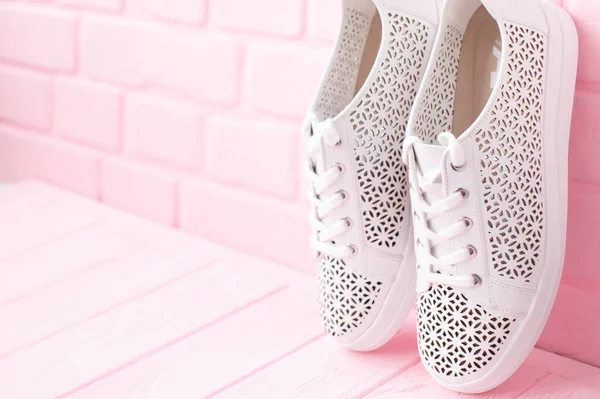 Close View Stylish White Sneakers Pink Brick Wall Background — Stock Photo, Image