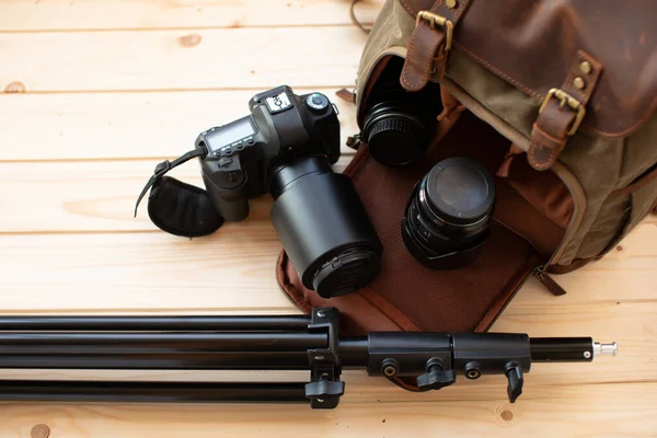 camera and digital equipment on wooden table