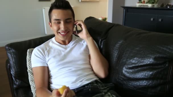 Young attractive boy  talking cell phone — Stock Video