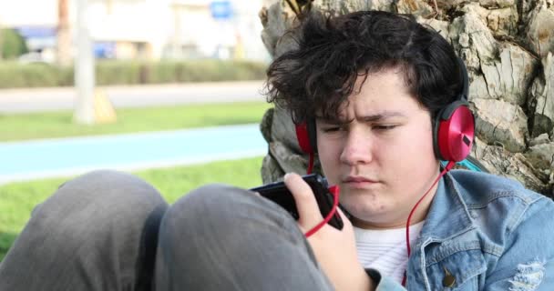 Portrait Handsome Teenage Boy Sitting Outdoor Alone Kid Watching Screen — Stock Video