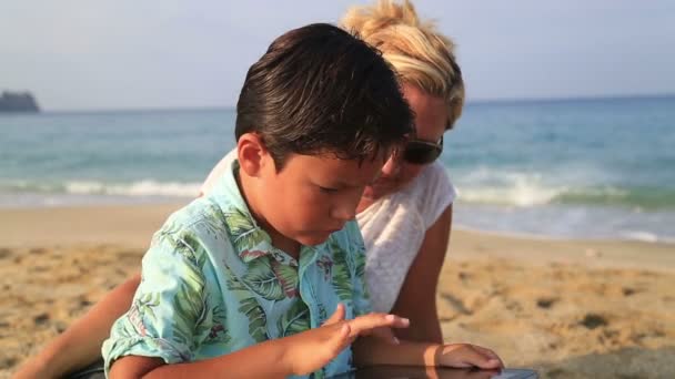 Mother and son with digital tablet