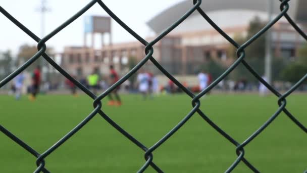 Soccer game behind the fence 3 — Stock Video