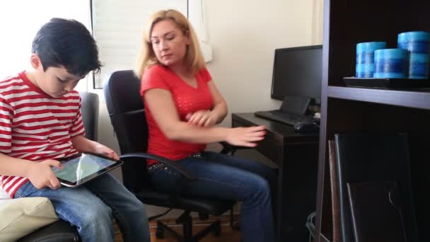 Mother and son using computer — Stock Video