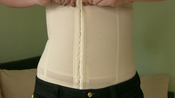 Woman Applying corset — Stock Video