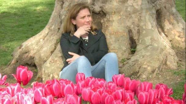 Worried women trying to relaxing in the park — Stock Video