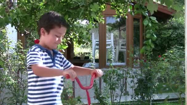 Portrait of little boy with scooters — Stock Video