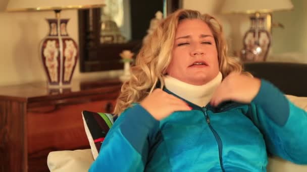 Painful woman with neck brace — Stock Video