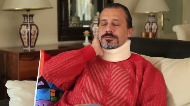 Painful man with neck brace — Stock Video