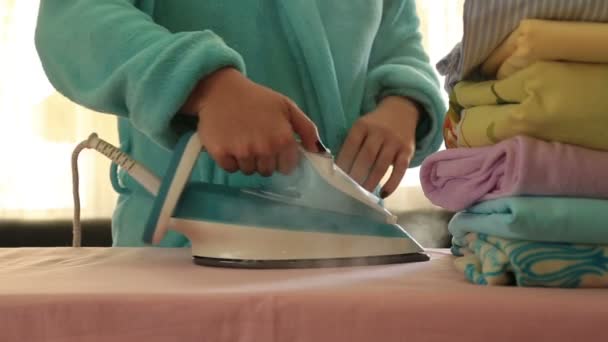 Woman ironing clothes with a steaming iron 3 — Stock Video