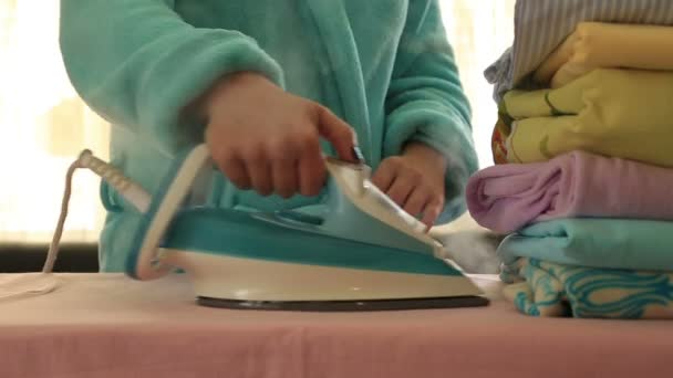 Woman ironing clothes with a steaming iron 5 — Stock Video