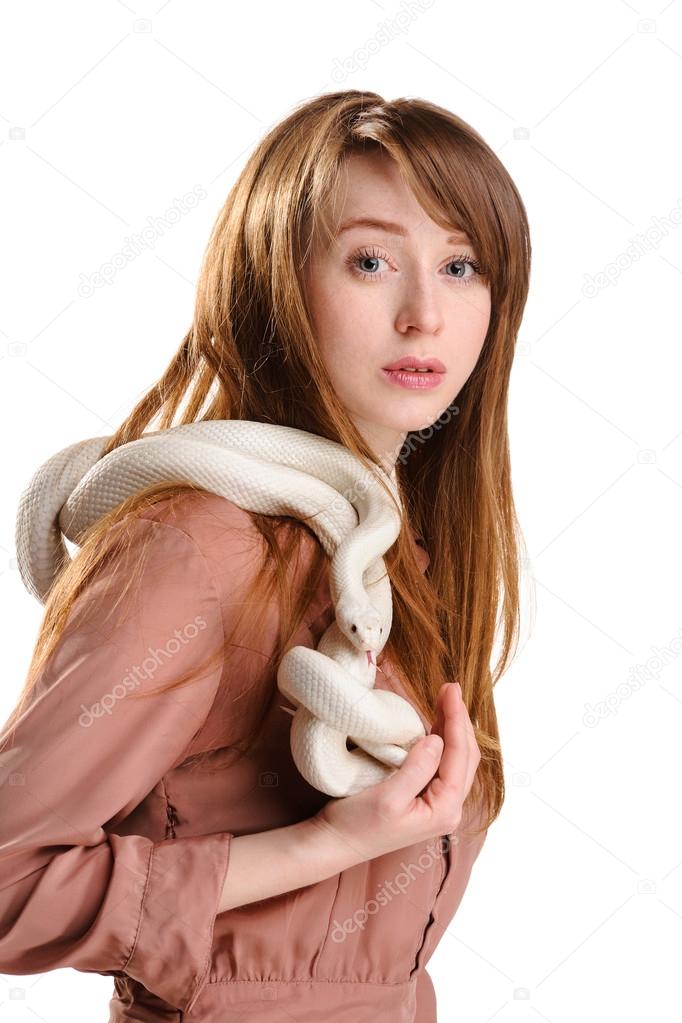 Isolated sensual red woman with freckles and albino white snake