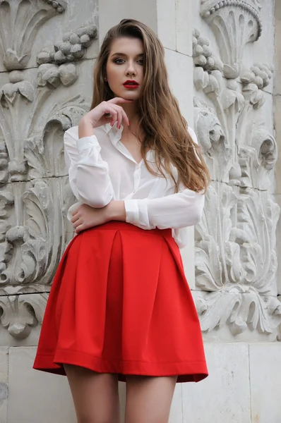 Beautiful young girl in red — Stock Photo, Image