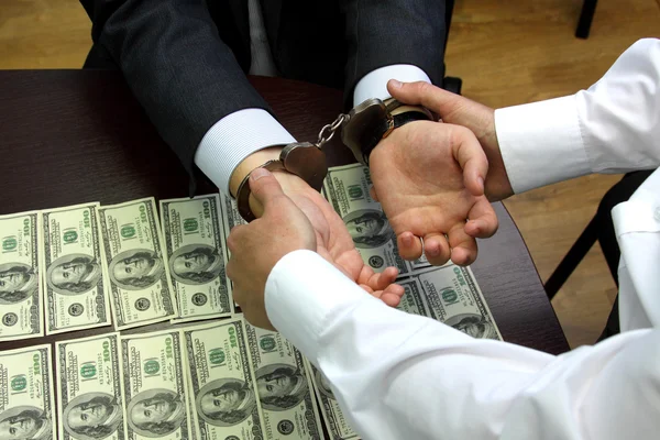 Bribe. American dollars. arrested for bribery. caught red-handed - Stock Image — Stock Photo, Image