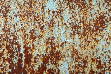 Mavi boyayla boyanmış metal bir yüzey parçası.