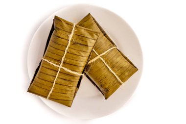 Tipik Meksika yemeği, Veracruz veya jarochos tamale, muz yaprağı, mısır unu ve kırmızı adobo ile hazırlanmış. İspanyol yemekleri, yani, İspanyolların Amerika 'ya gelişinden beri hazırlanan yemekler.