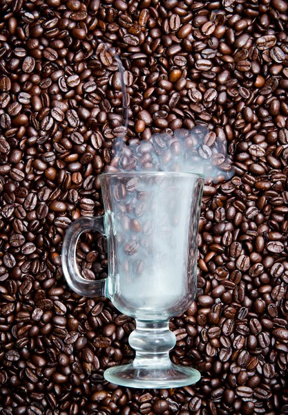 Irish coffee glass with smoke in coffee beans — Stock Photo, Image