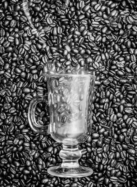 Irish coffee glass with smoke in coffee beans — Stock Photo, Image