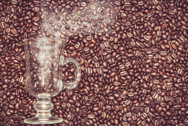 Irish coffee glass with smoke in coffee beans — Stock Photo, Image