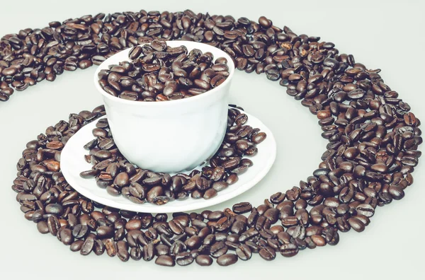 Coffee cup in a coffee whirl — Stock Photo, Image