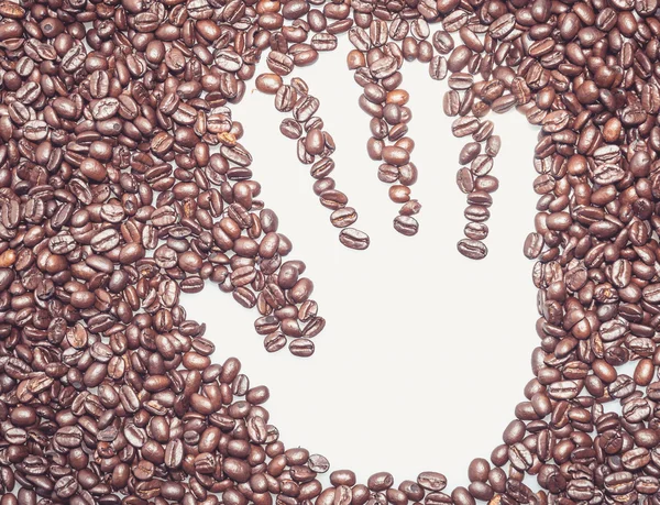 Hand in einen Kaffee — Stockfoto