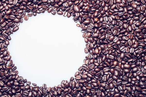 Kaffeebohnen Textur mit einem weißen Kreis für Text — Stockfoto