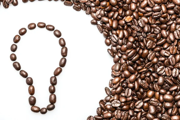 Coffee texture with a lightbulb symbol — Stock Photo, Image