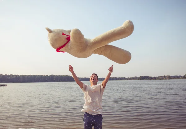 Guy with a big teddy bear — Stock Photo, Image