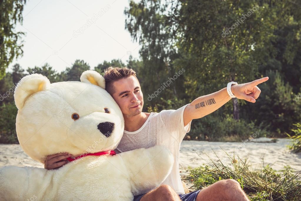 Guy with a big teddy bear