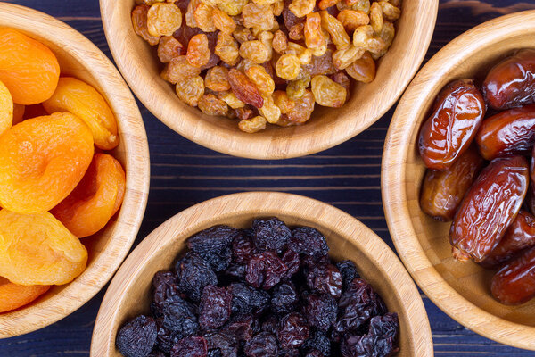 Dried fruits assortment on wooden background. Top view